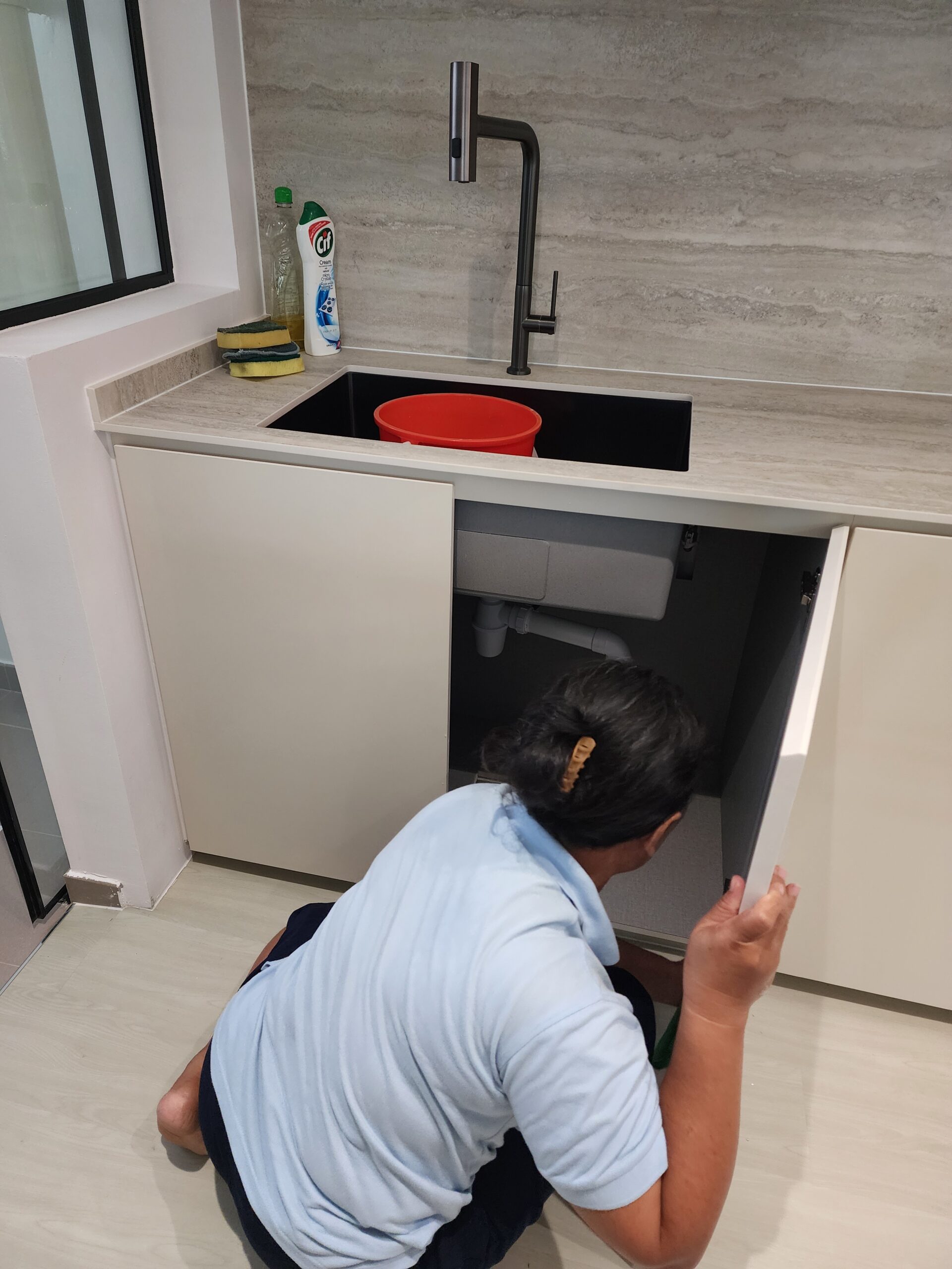 Wiping of Kitchen Cabinets