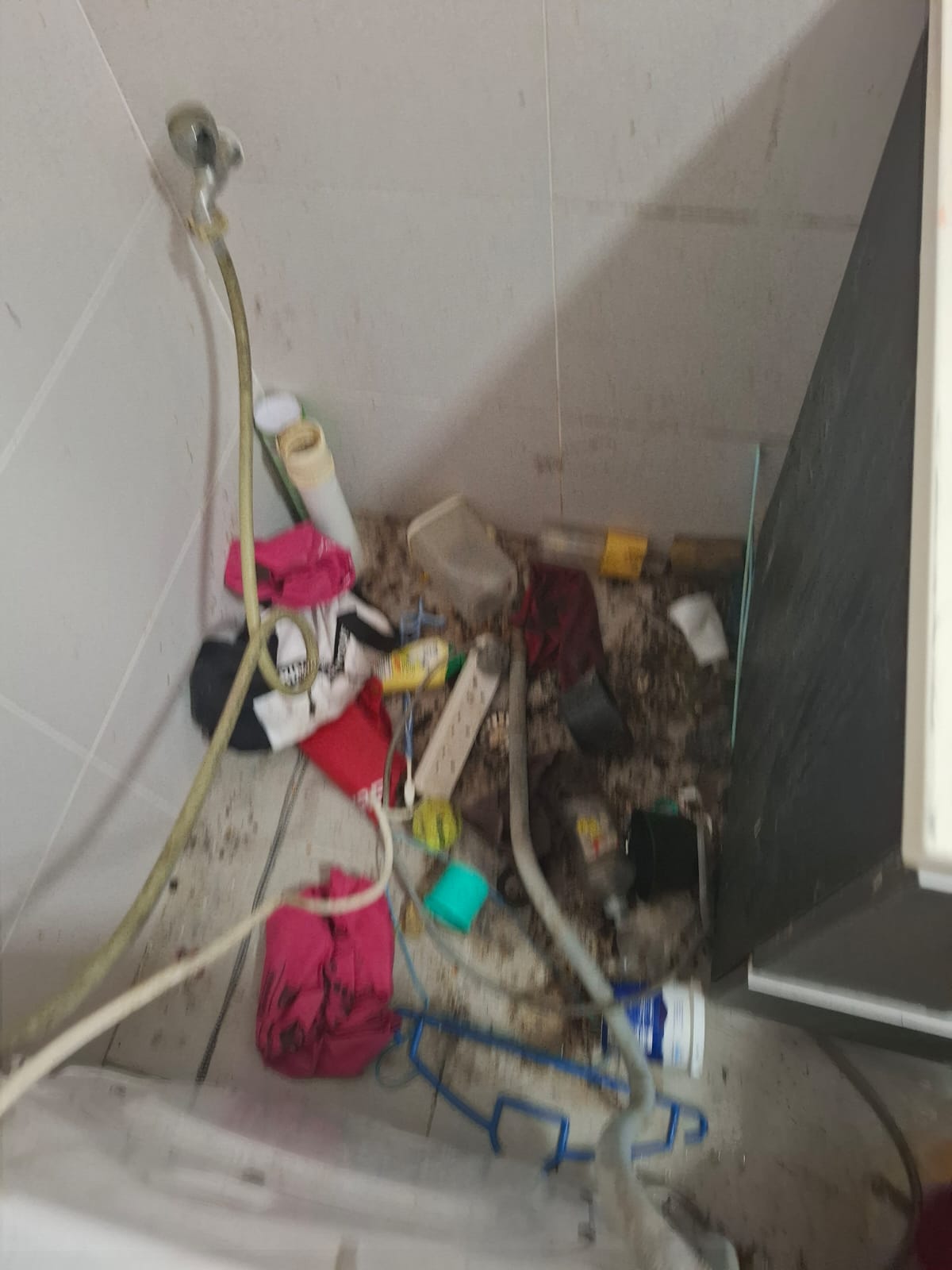 Rubbish behind Washing machine